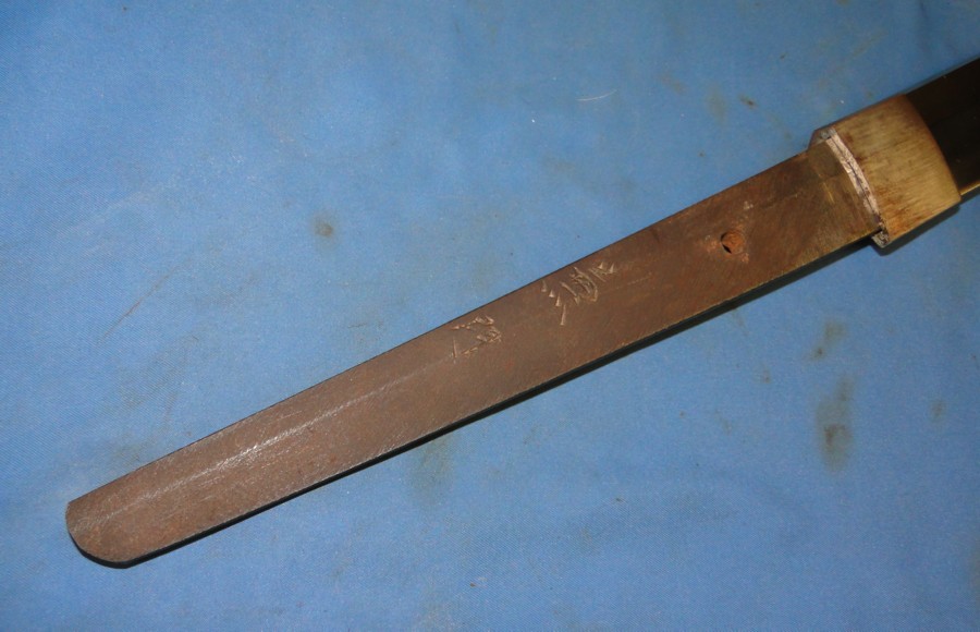 View of Katana tang showing maker's signature- Kanekado